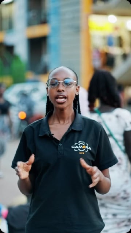 A Camera Hub staffer filming on the street in Kampala